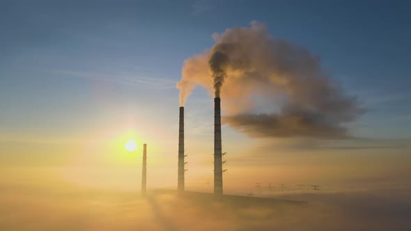 Aerial View of Coal Power Plant High Pipes with Black Smoke Moving Up Polluting Atmosphere at