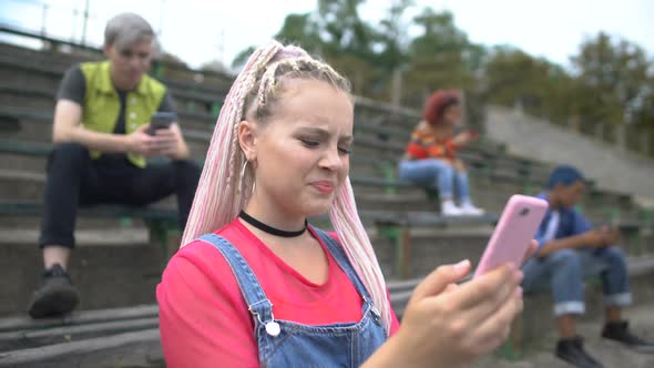 Female Student Watching Disgusting Video by Smartphone App, Internet Addiction