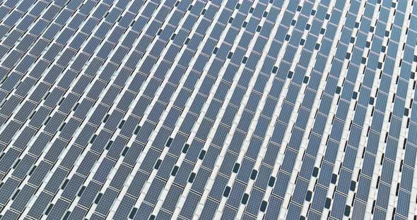 Aerial View of Floating Platform Cell Solar Panels on the Water in Pond