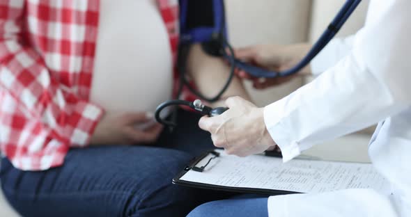 Doctor Measuring Blood Pressure to Pregnant Woman Closeup  Movi