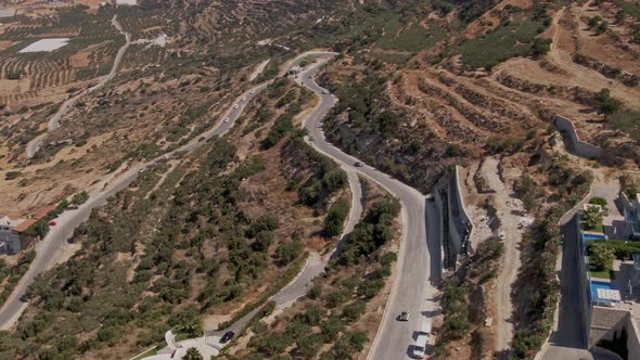 Beautiful hillside curvy road to Falasarna beach in Crete island, aerial drone view