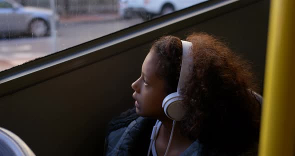 Girl listening music while travelling in bus 4k