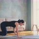 Woman in Sportswear Does Push Ups Training in Living Room - VideoHive Item for Sale