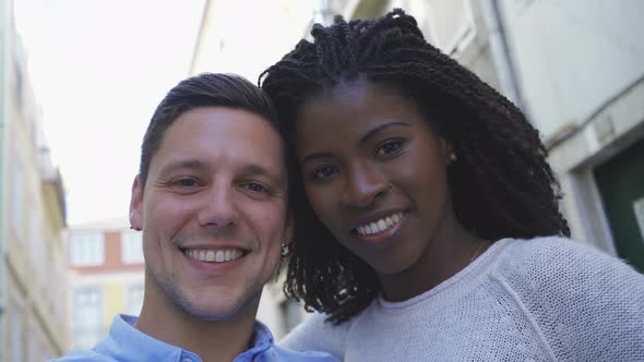 Happy Young Couple Having Fun While Posing for Selfie