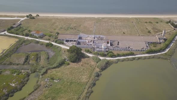 Aerial, towards, Drone Shot Tilting Towards A historic ruins, Surrounded By shallow water pools, on