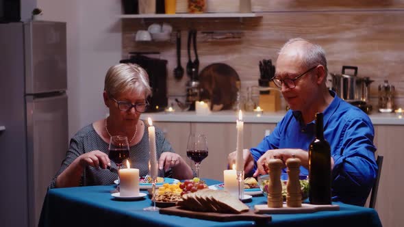 Couple with Red Wine Glasses