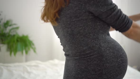 A Cute Pregnant Woman Dansing