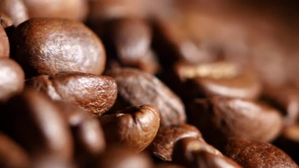 Big Heap of Fragrant Roasted Brown Coffee Beans. Rotating. Close Up