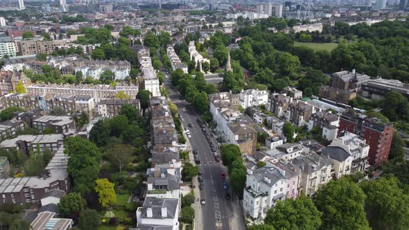 Primrose hill London , rising drone aerial reveal city skyline in distance