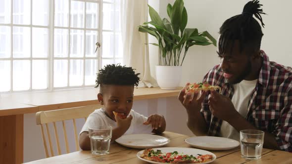 Father and son eating together