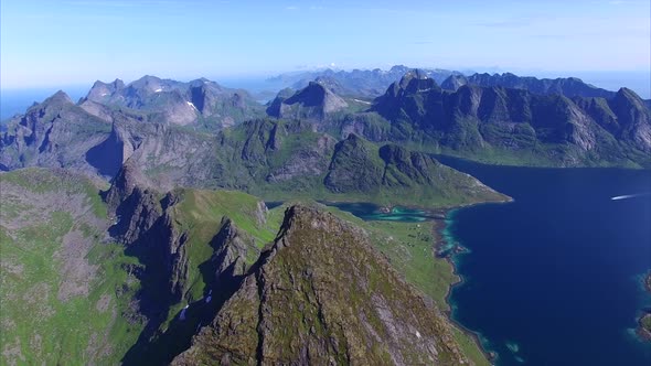 Flying over peak on Lofoten islands in Norway