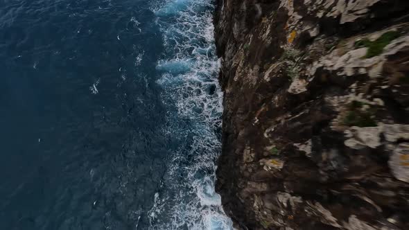 FPV Racing Drone Mountain Surfing and Cliff Diving Along the Rocks