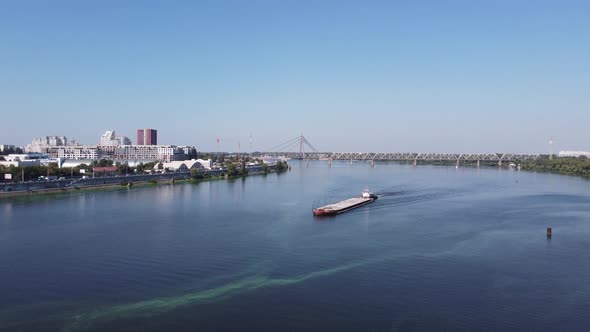 A Dry Cargo Ship Pushes an Empty Barge Down the Dnieper River