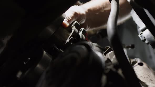 Working Day in Car Service Close Up Shot of Removing Antifreeze Pump From Car