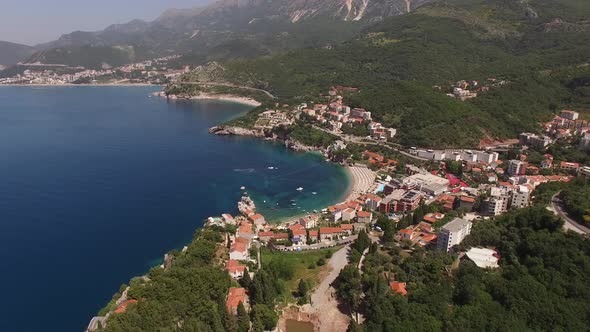 Drone View of Buildings Among Trees on the Sea Coast Near Queens Beach