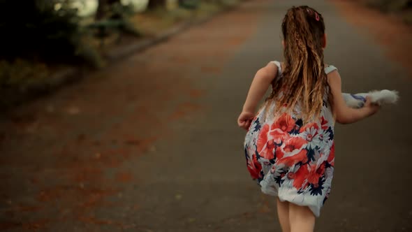 Little Girl Running Away Parents. Young Children Enjoy Playing Funny Activity Together With Father.