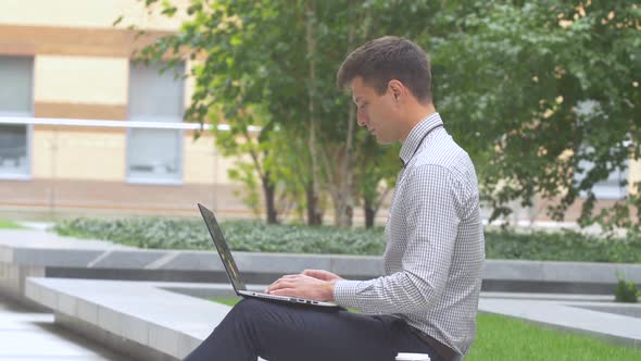 Stylish Businessman Working on Laptop Outdoors, Terrace, Cup of Coffee