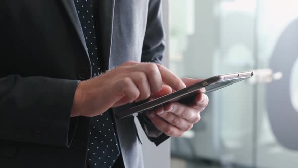 Businessman using digital tablet in office 4k