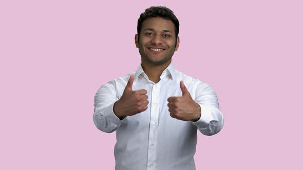 Successful Businessman Showing Two Thumbs Up