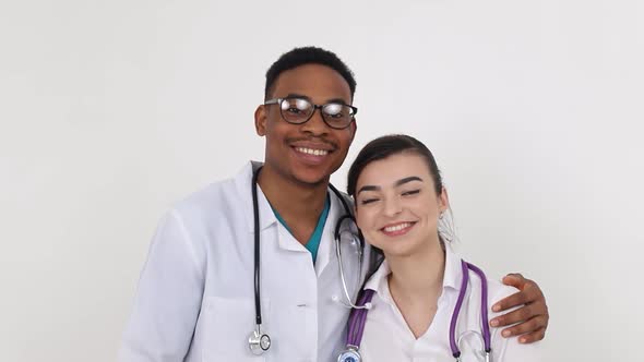 Young African doctor with a European girl of a doctor. Treatment concept.