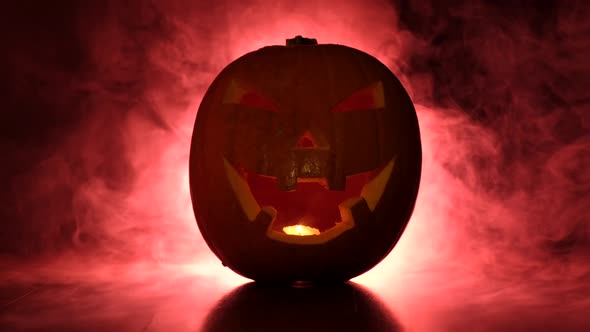 Halloween Pumpkin in Dark Night and Red Mist