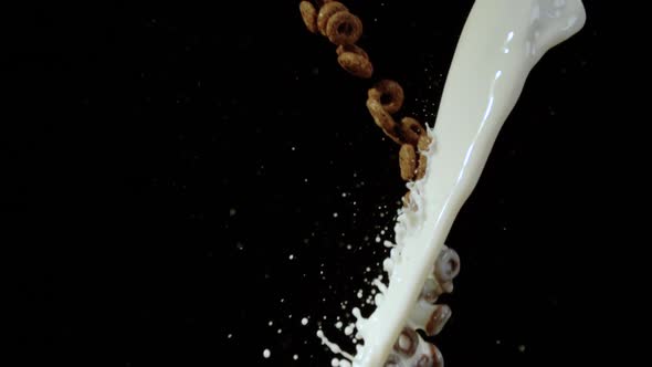 Chocolate cereal rings and a stream of milk, Ultra Slow Motion