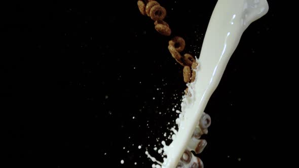 Chocolate cereal rings and a stream of milk, Ultra Slow Motion alt