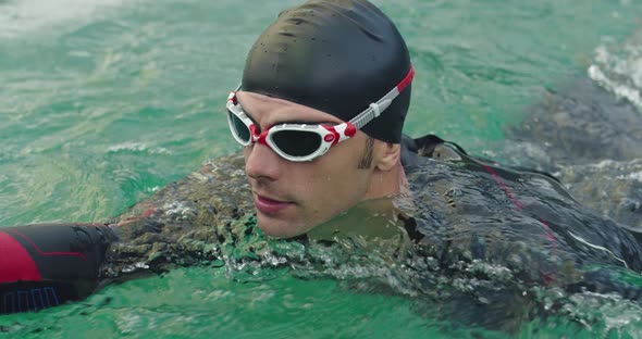 Triathlete Swimmer Having a Break During Hard Training