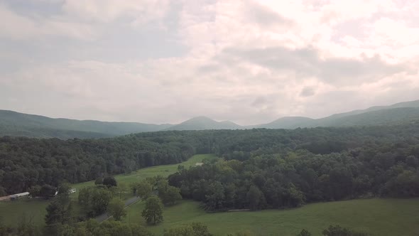 Drone flying forward over trees and forest in the Smoky Mountains in eastern Tennessee during a clou