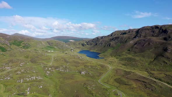 The Road to An Port at Kiltyfanned Lough Between Ardara and Glencolumbkille in County Donegal