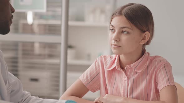 Pediatrician Examining Schoolgirl