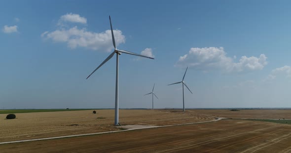 4K aerial view of windmills farm. Modern wind turbines.