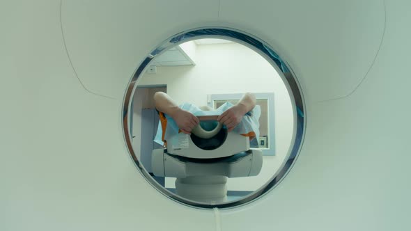 Mri Scanning Mechanism Is Inspecting A Patient