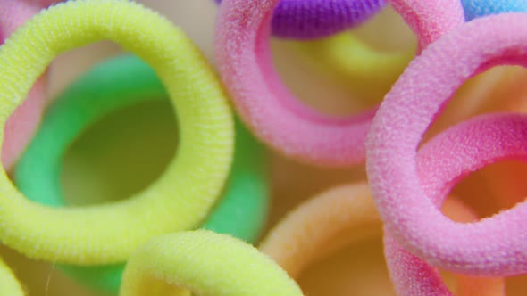 Close Up of Rotating Multi Colored Rubber Bands