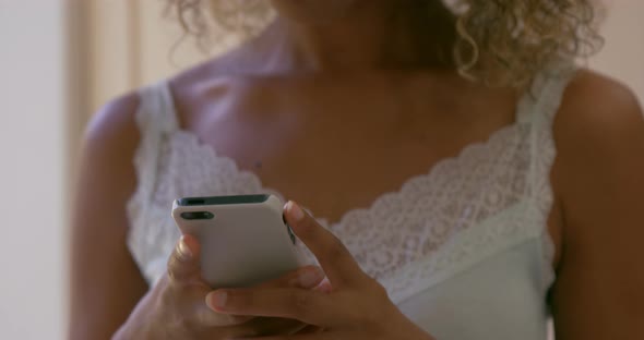 Young woman text messaging on phone