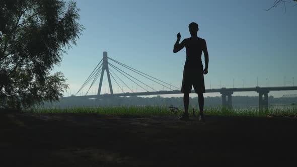 Guy Doing Workout in the Town Outdoors