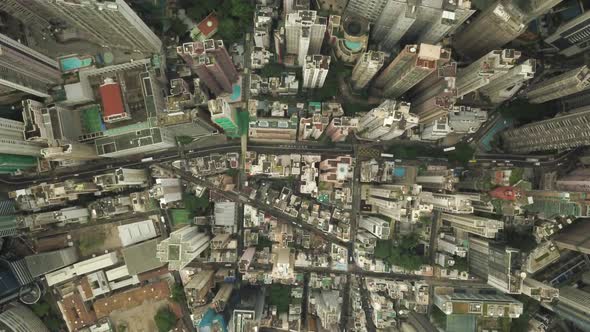 Static aerial top view of Hong Kong city with traffic flowing through