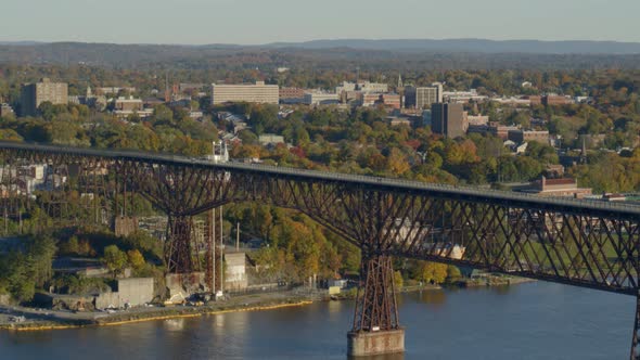 Aerial of walkway over Hudson river and town at a distance