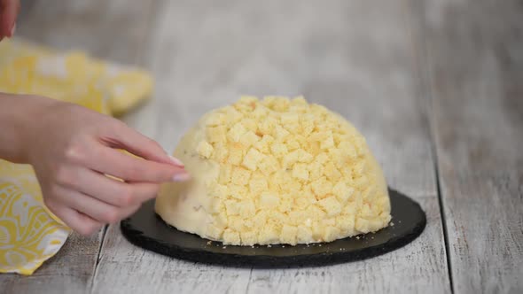 Woman Makes Traditional Mimosa Cake with Pineapple