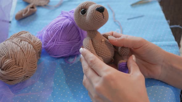 Handicraft Master. Checks the Sewn on Paws for a Plush Puppy. Uses Pins. Crochet Toys Master Class