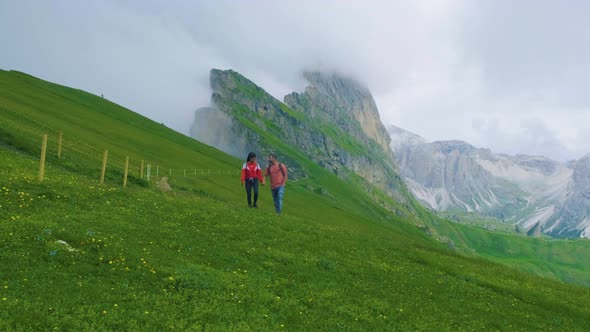 Couple on Vacation Hiking in the Italien Dolomites Amazing View on Seceda Peak