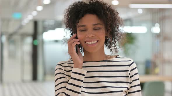 African Woman Talking on Smartphone