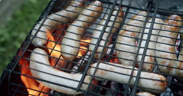 Sausages Are Fried on an Open Fire, Close Up Slow Motion V3