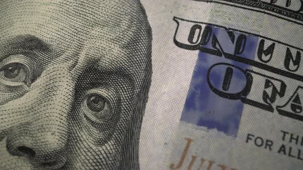 American one hundred dollar paper banknote in close up macro view dolly shot.