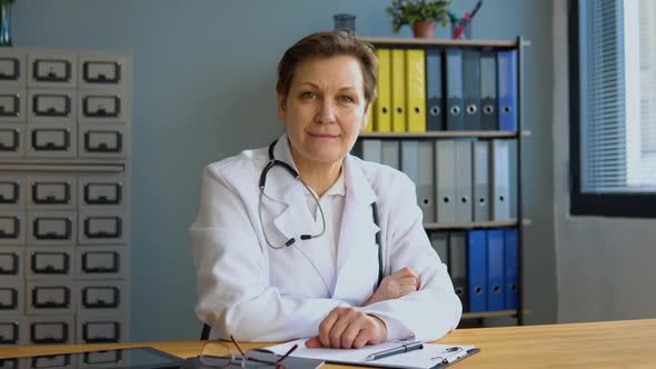Portrait of a Senior Female Doctor Sitting in Her Office