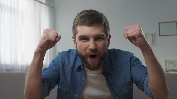 Man Expressing Incredible Happiness, Excitement, Raised Fists Gesture of Victory