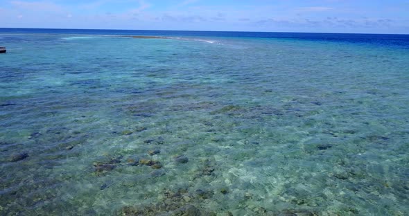 Beautiful above tourism shot of a sunshine white sandy paradise beach and aqua blue ocean background