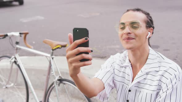 Mixed race man on FaceTime with a friend