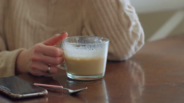 Unrecognizable Woman Drinking Coffee