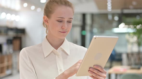 Young Businesswoman using Tablet 